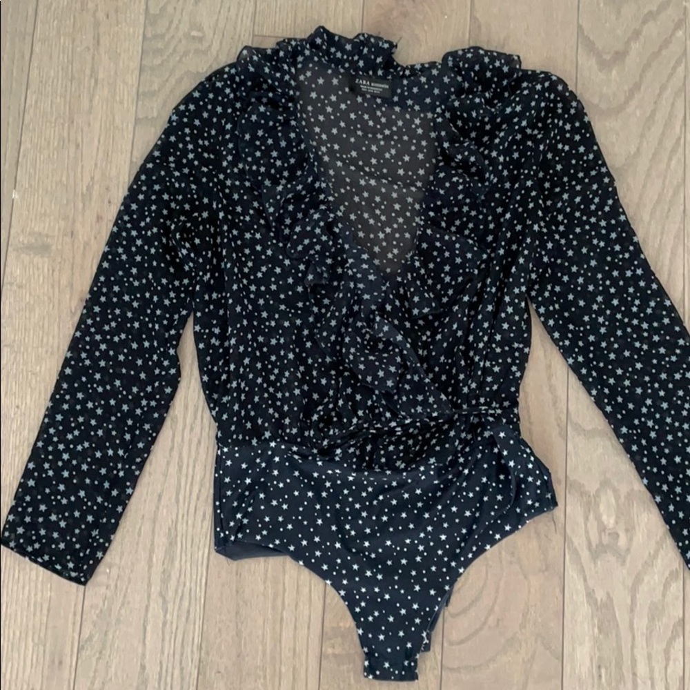 Sheer never worn body suit with baby blue stars